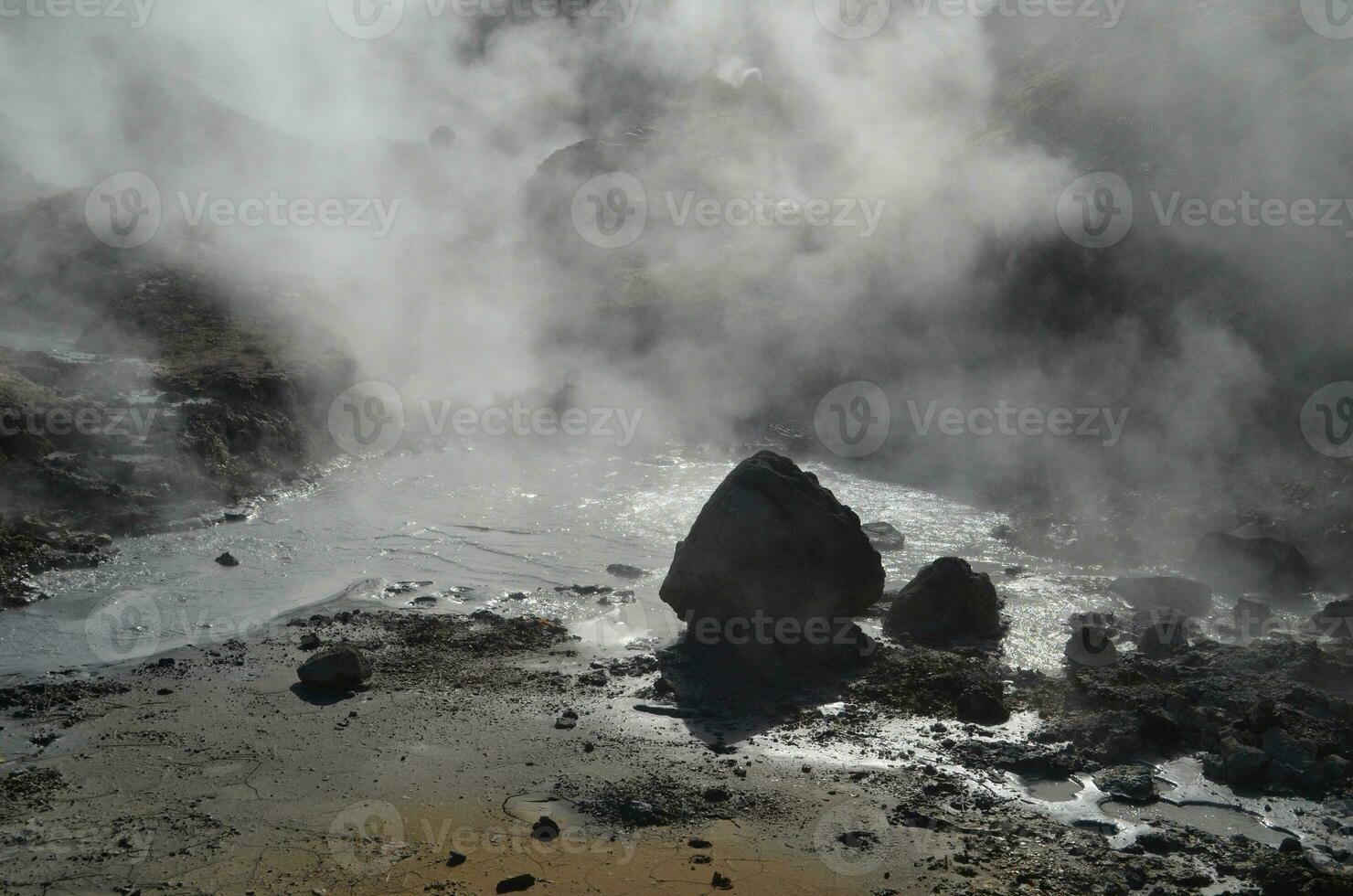 Natural Hot Spring with Steam Rising from it Iceland photo