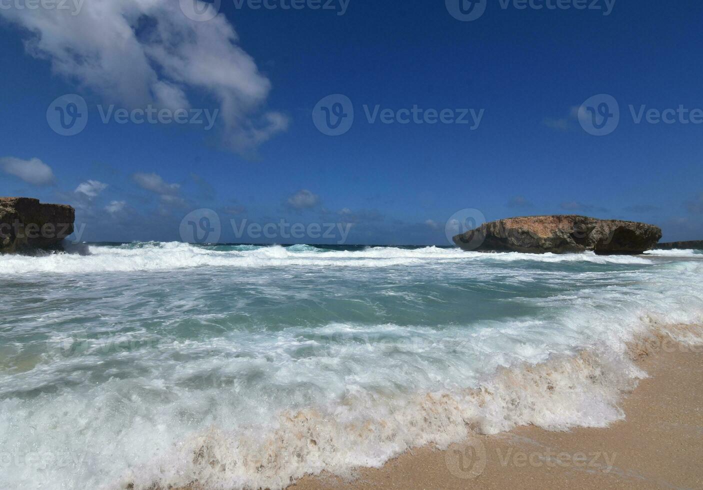 Scenic Views of Waves Rolling Ashore in Aruba photo