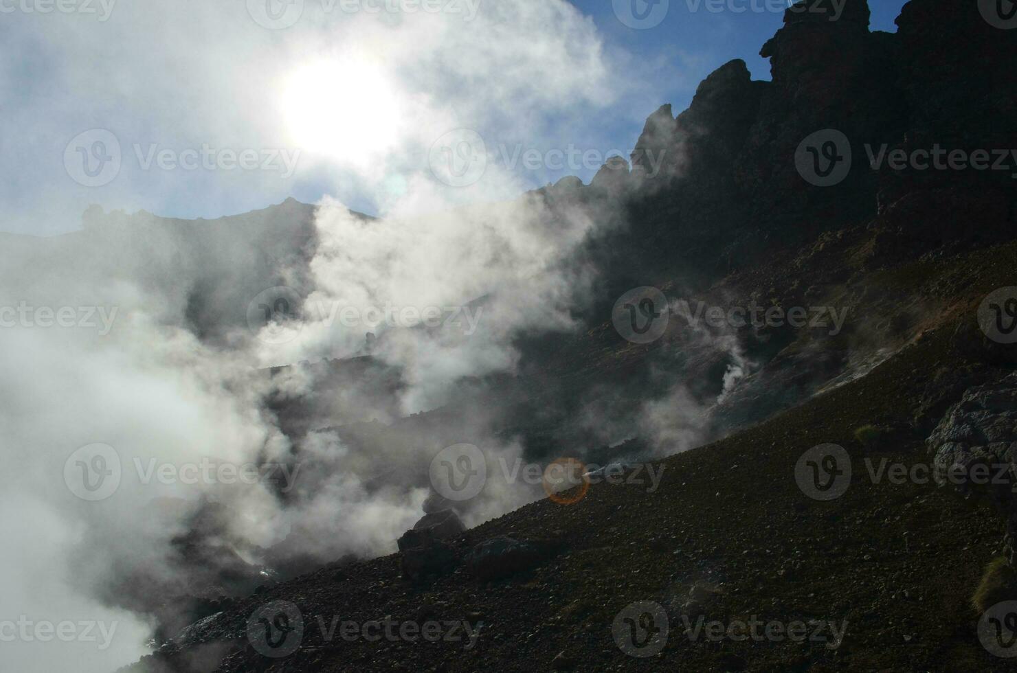Fumaroles with Geothermal Steam Rising Up from the Earth photo