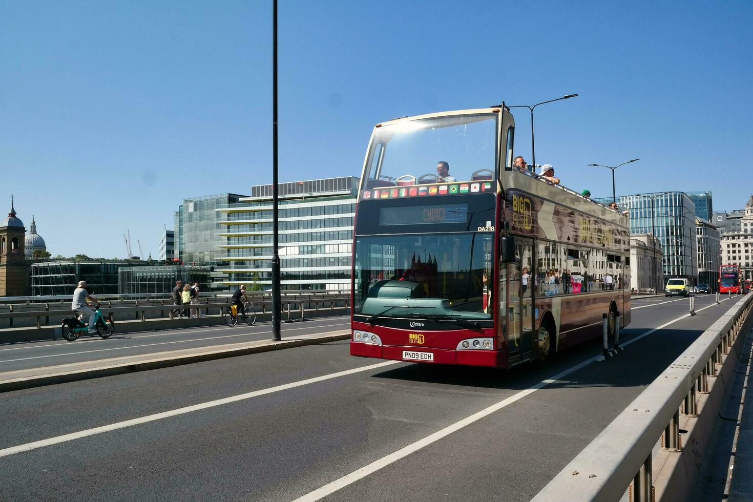 Gorgeous Low Angle view of Bus Service and British Traffic at London Bridge Which is Most Famous and Historical Bridge over River Thames at Central London City of England UK. June 4th, 2023 photo