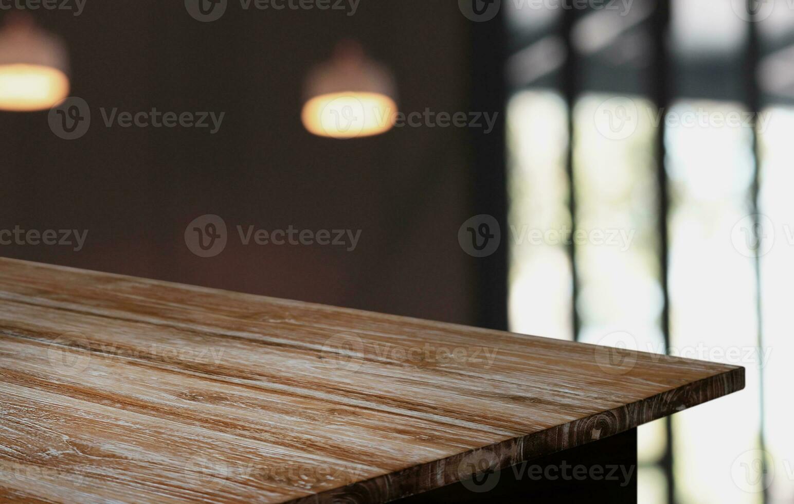 Wood Table Top in Blur Background room interior with empty copy space. photo