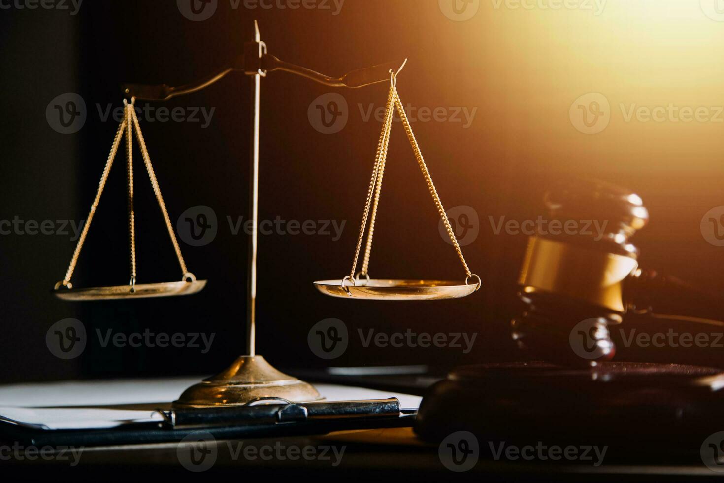 law legal technology concept. judge gavel on computer with scales of justice on desk of lawyer. photo