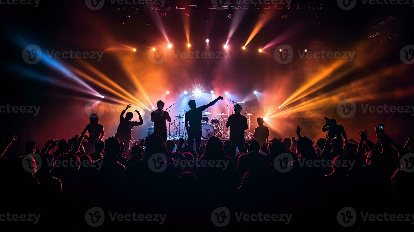 Rock band performing in front of bright stage lights surrounded by young audience. silhouette concept photo