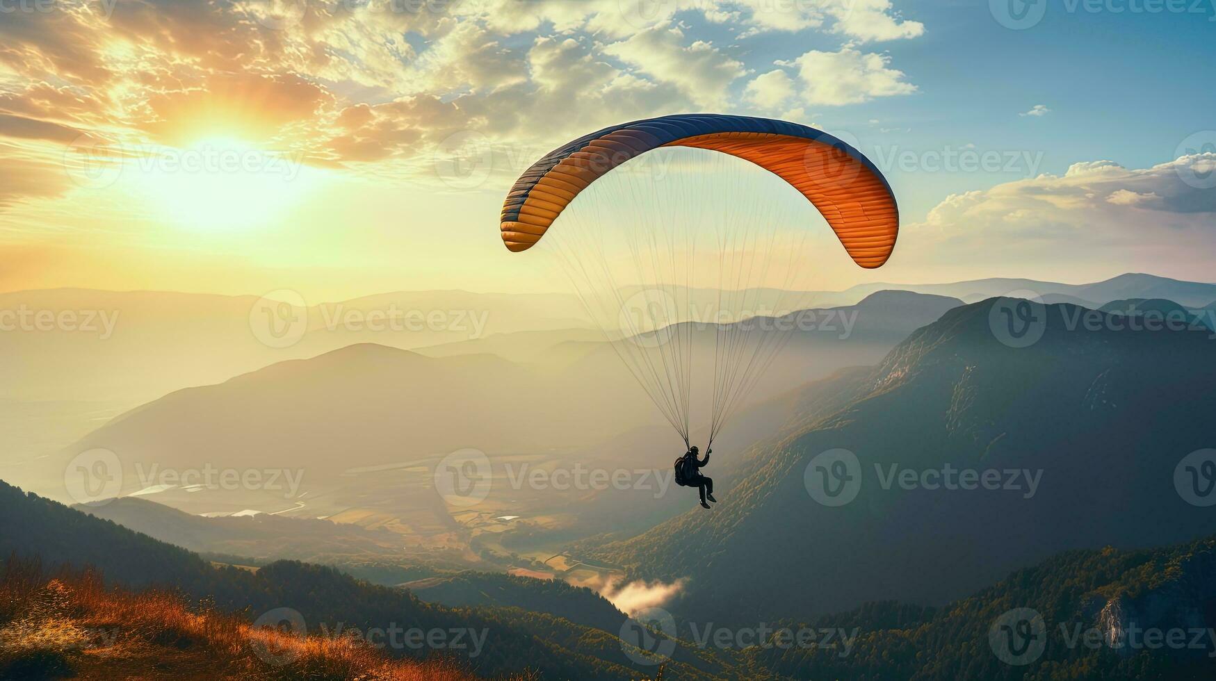 Vintage colored paraglide silhouette above misty Crimea valley at sunrise photo