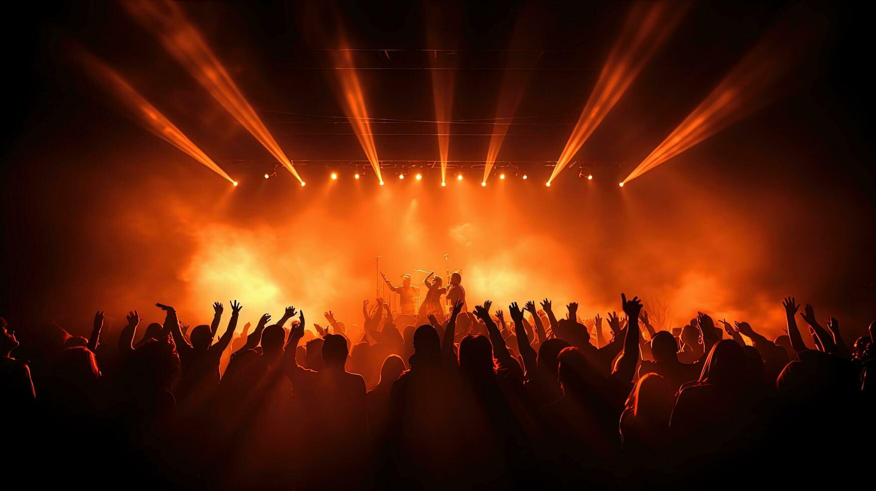 Crowd at a concert claps while musicians perform onstage illuminated by spotlight with dancing people. silhouette concept photo