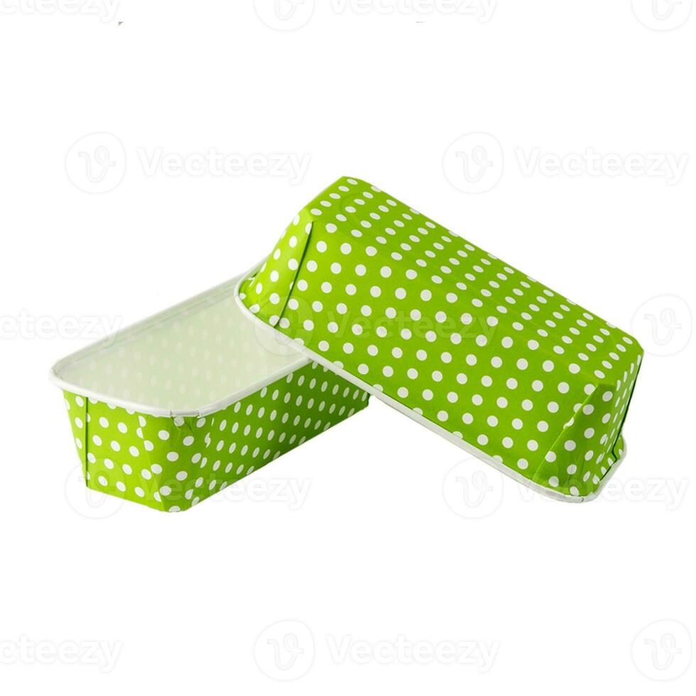 Green paper baking forms for cakes with dotted pattern photo