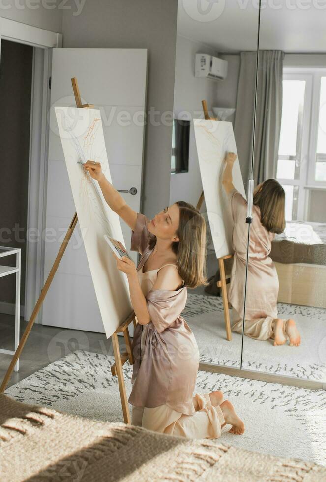 Pretty talented woman painter painting on easel making colorful sketches creating wonderful art. Beautiful female artist painting with pastel. Creativity and imagination concept photo