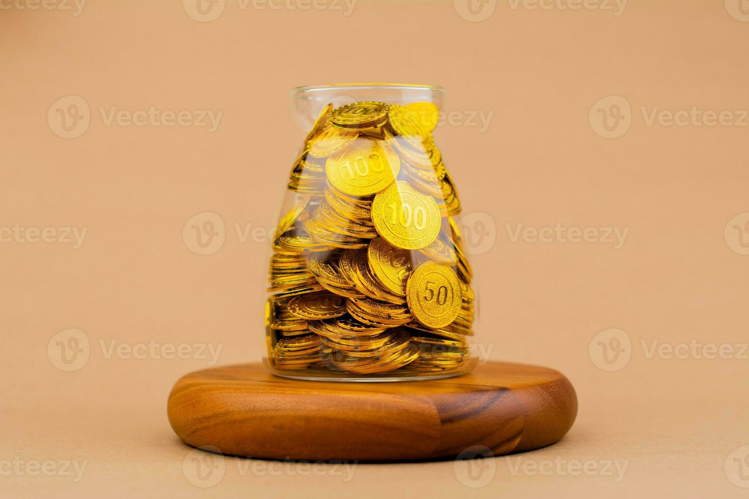 Saving gold in a glass jar Real estate and valuables Gold coins World gold market Gold stocks Invest in gold photo