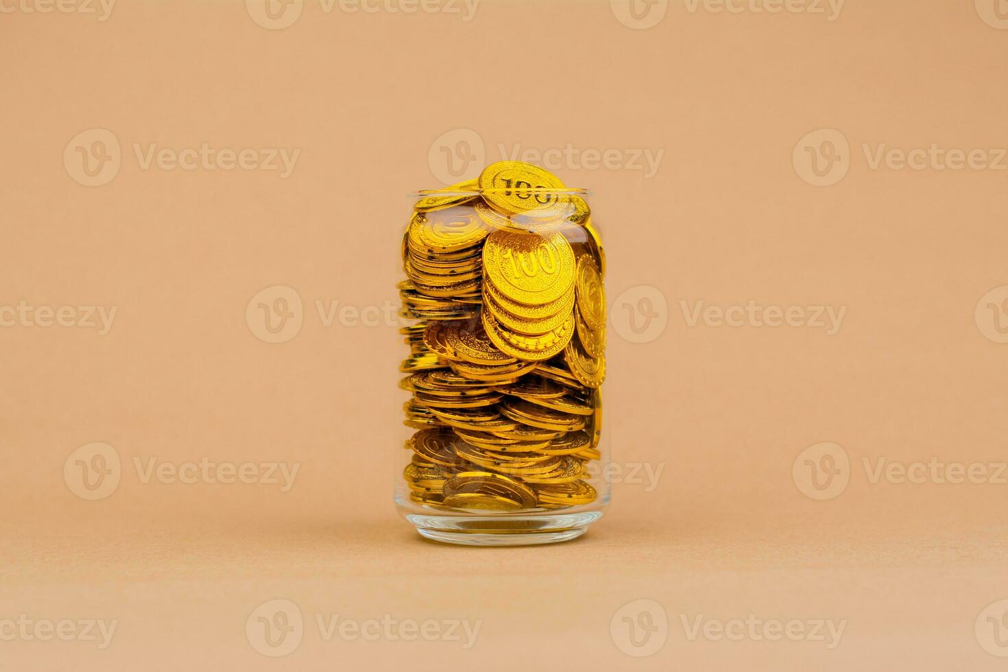 gold in glass jar gold savings in glass jar valuable assets Financial loans and investments. Gold stocks. Gold market. Gold concept and gold accumulation. photo