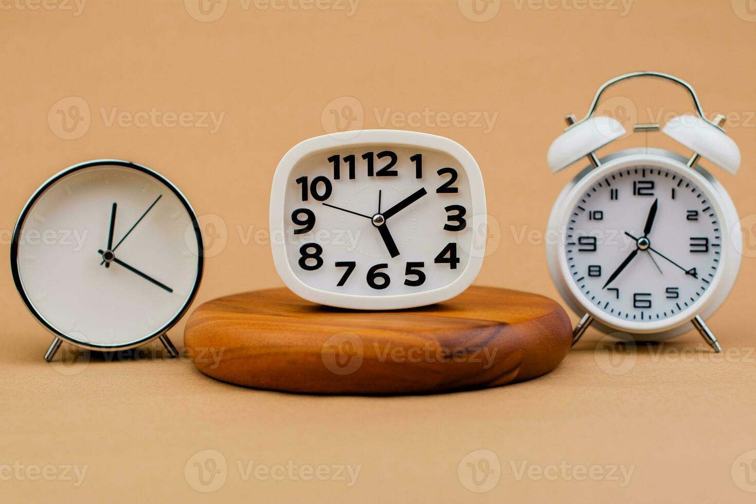 Alarm clock placed on a wooden stand, time work concept the value of limited time Appointments and punctuality at work photo