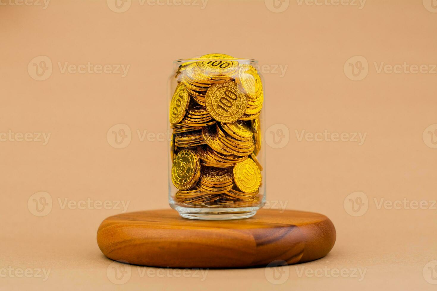 Saving gold in a glass jar Real estate and valuables Gold coins World gold market Gold stocks Invest in gold photo