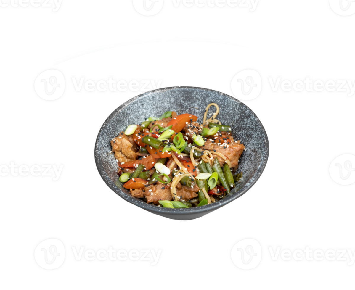 A bowl of udon noodles, veal and fried vegetables angle view on transparent background png