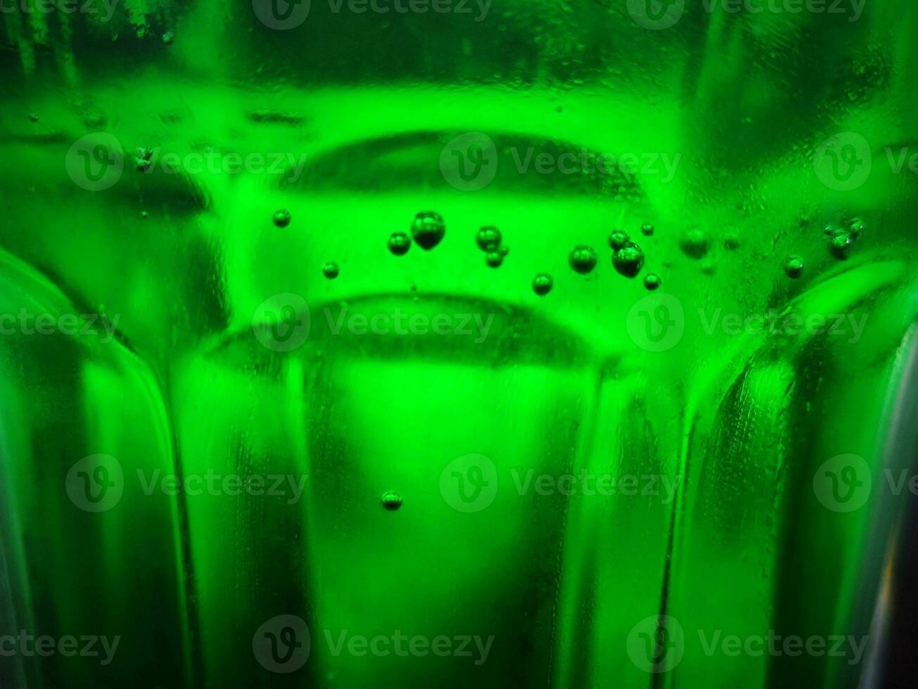 Green glass abstract background, close view photo