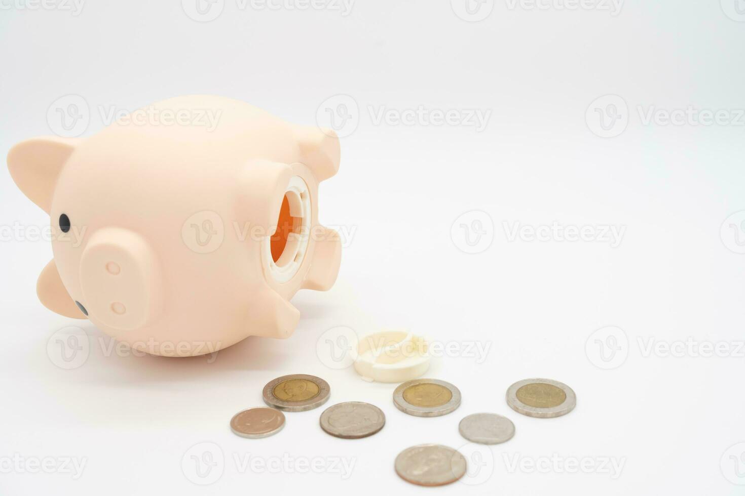 Open piggy bank with money on isolated background. getting money from a piggy bank. photo