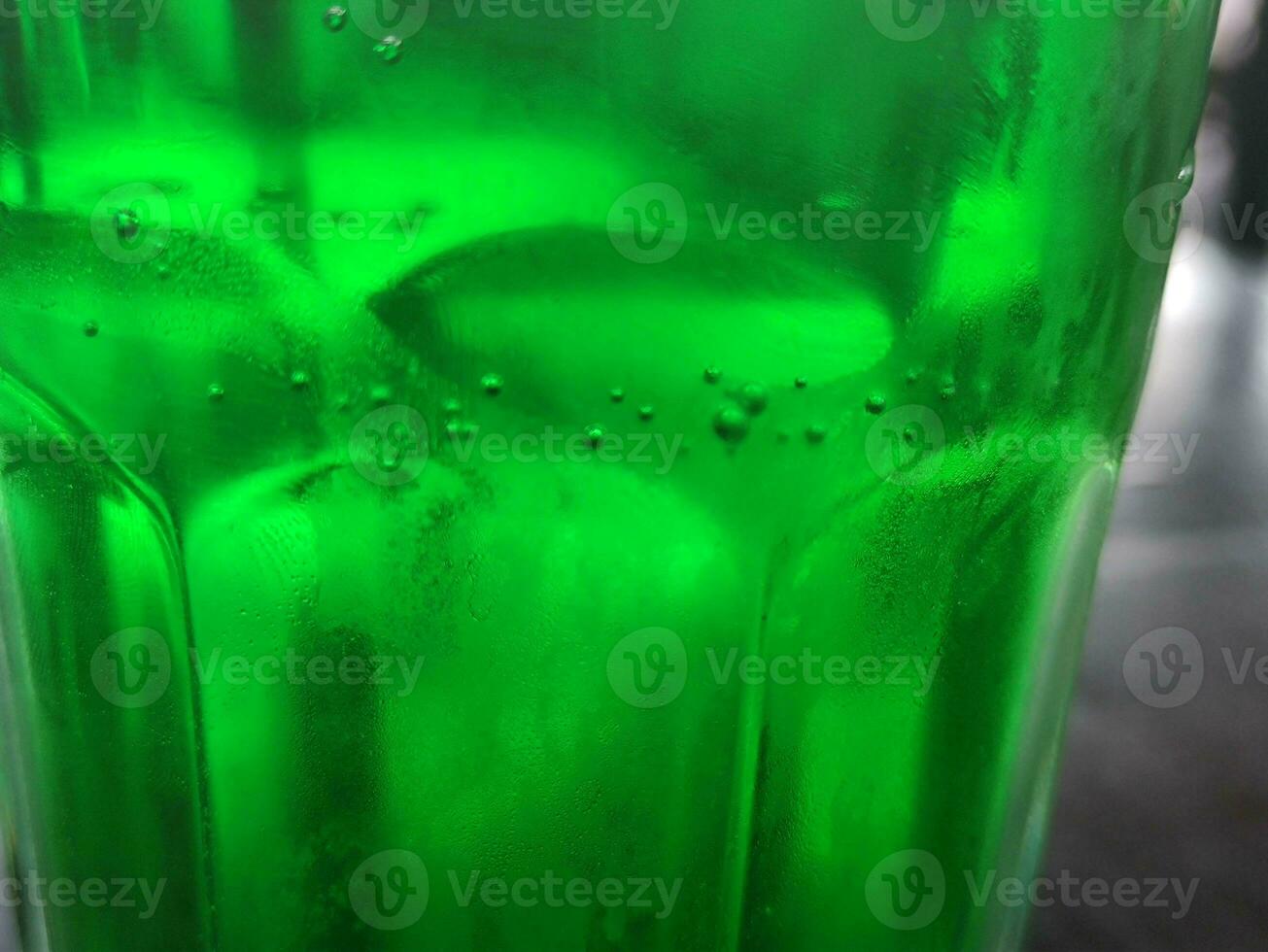 Green glass abstract background, close view photo