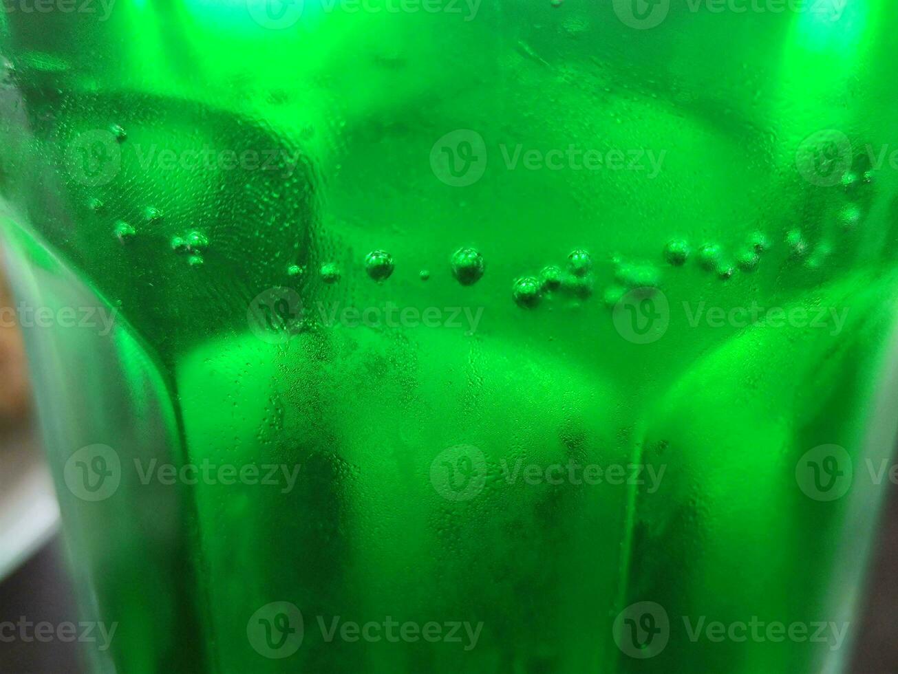 Green glass abstract background, close view photo