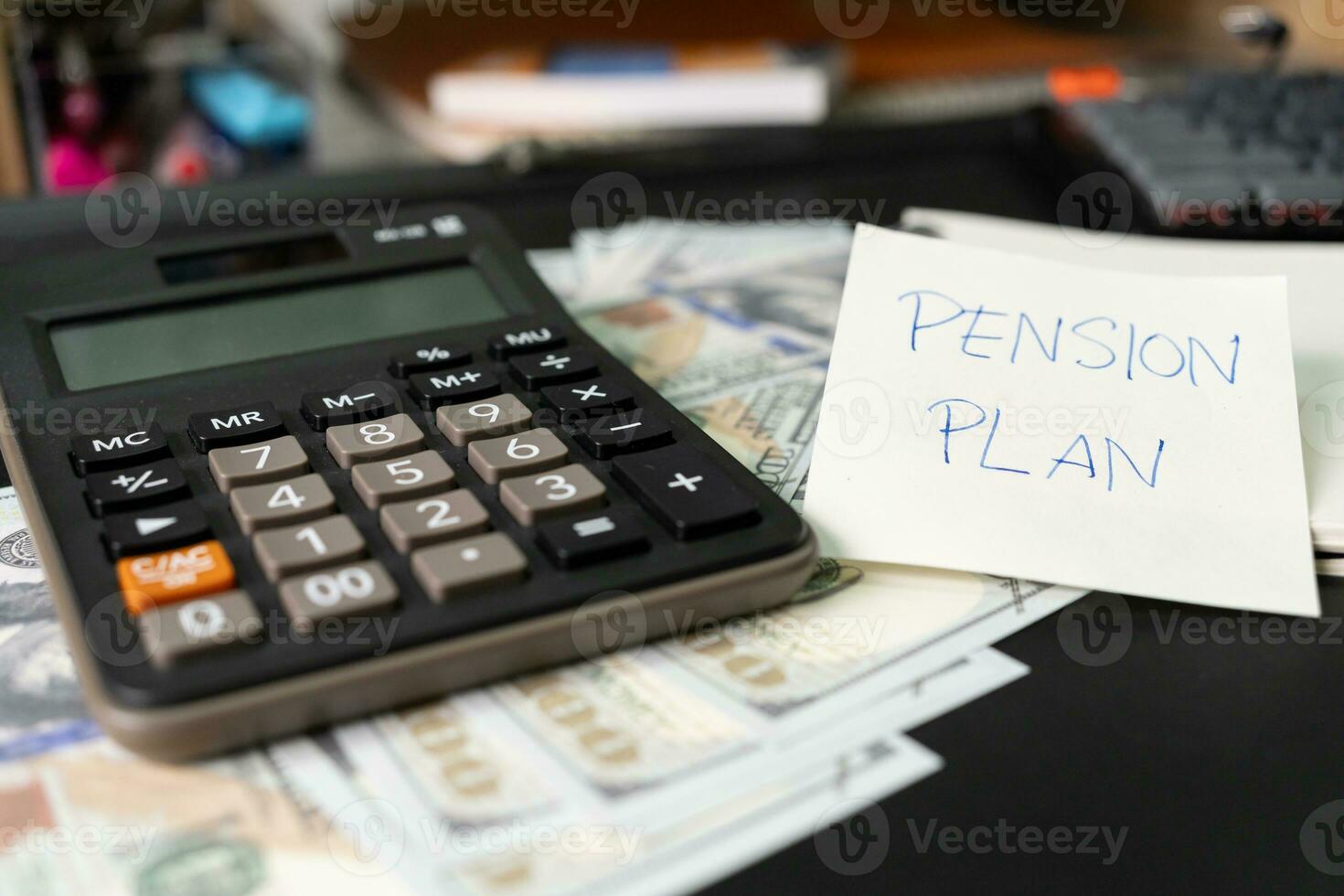 Paper note with text written PENSION PLAN, Calculator, Pen. Investments Concept. Pension Plan. Retirement concept. Pension calculation concept. photo