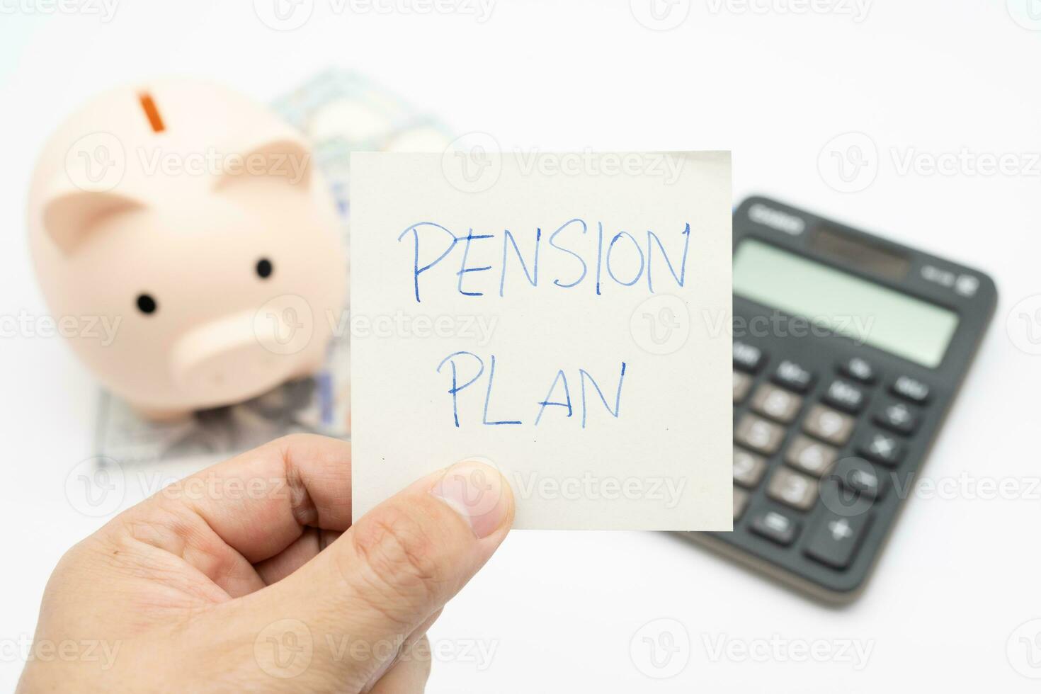 Paper note with text written PENSION PLAN. Investments Concept. Elderly Spouses Saving Money, Pension Plan. Retirement concept. isolate background. photo