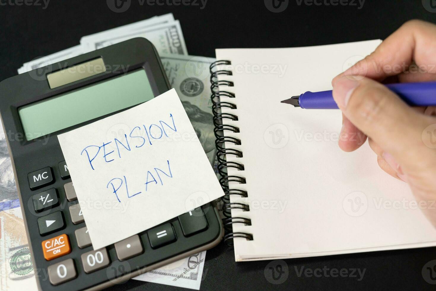 Paper note with text written PENSION PLAN. Investments Concept. Pension Plan. Retirement concept. Pension calculation concept. photo