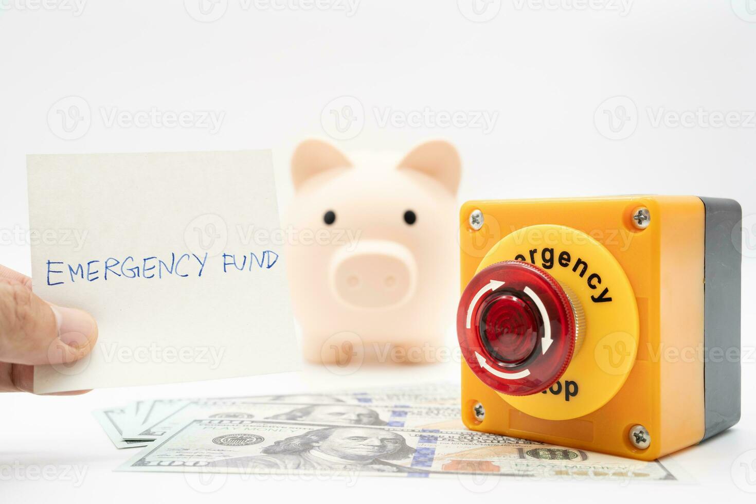 Concept of emergency savings fund. A piggy bank with dollar and stop button. money with piggy bank for saving emergency money. photo