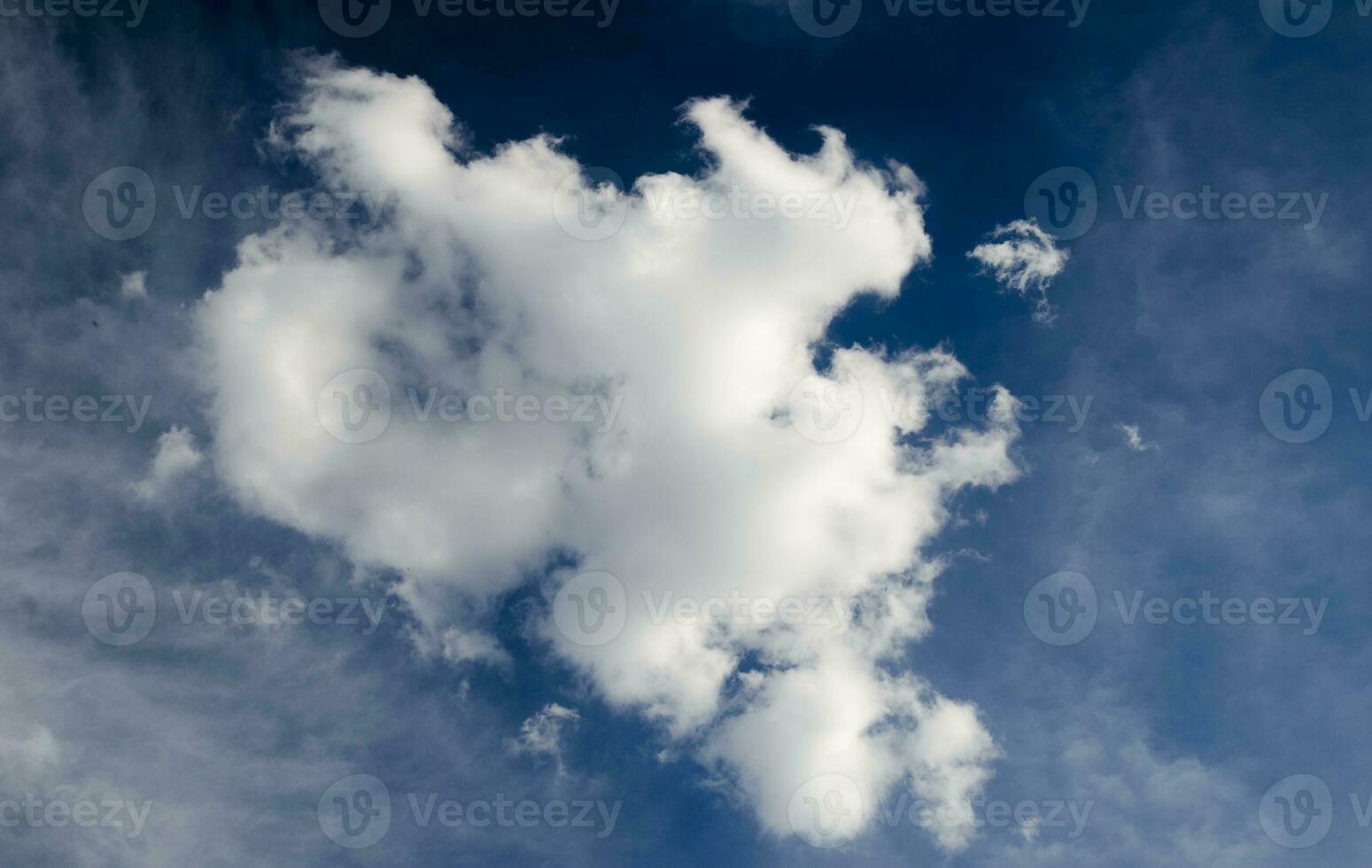 White cloud in deep blue sky photo