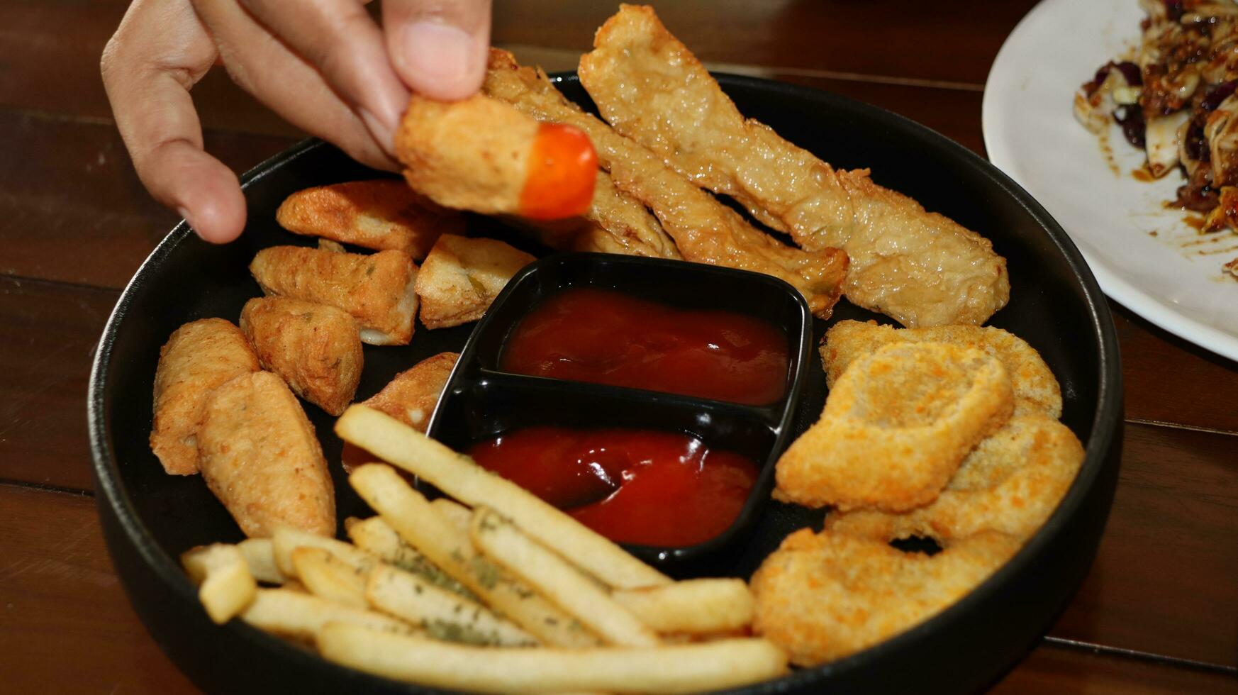 French fries, Nuggets and delicious fried otak otak served with Spicy Sauce photo