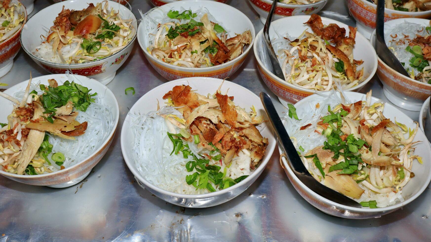 Close up of several bowls of Soto photo