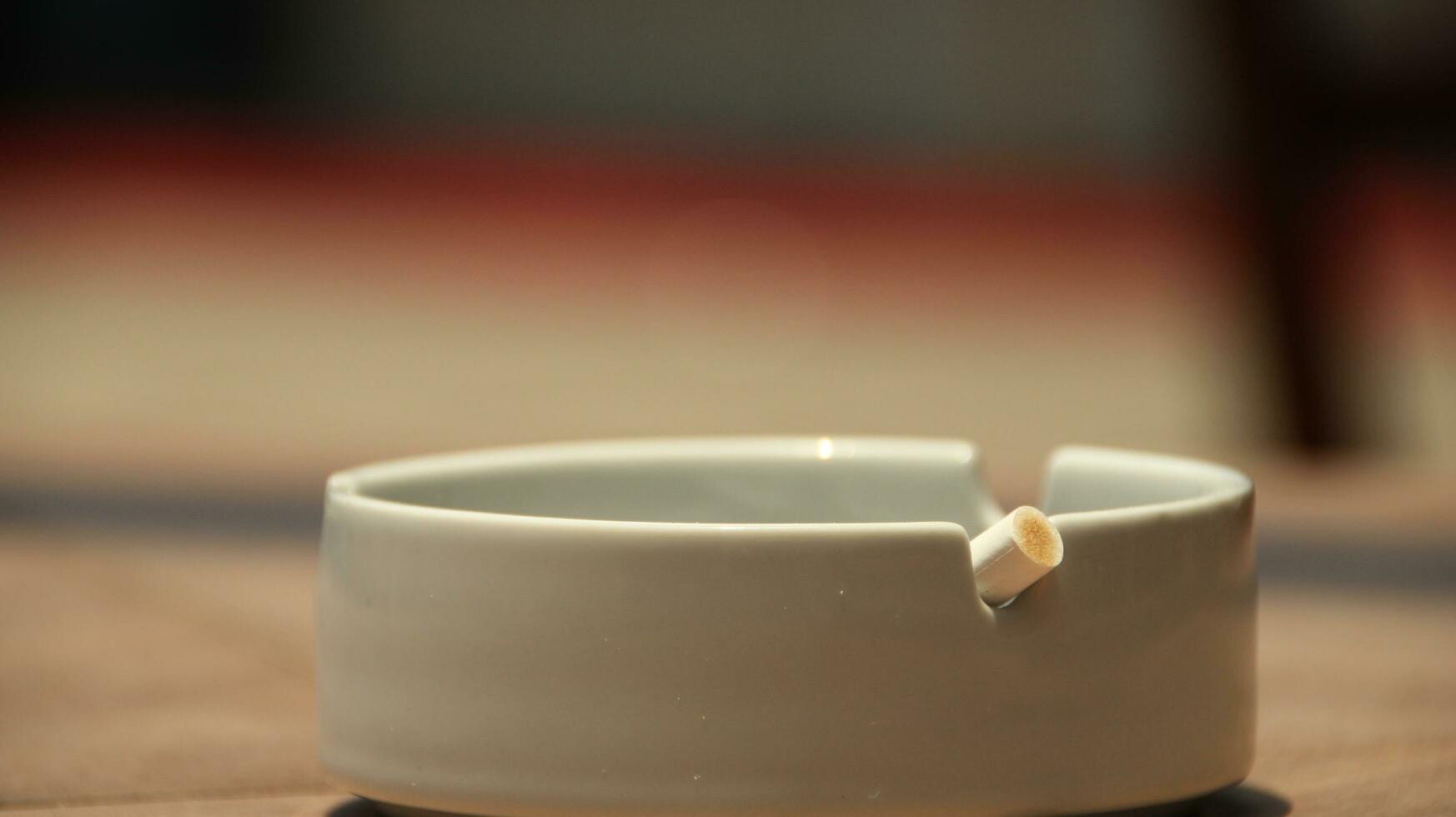 Closeup of empty ashtray with blurred background photo