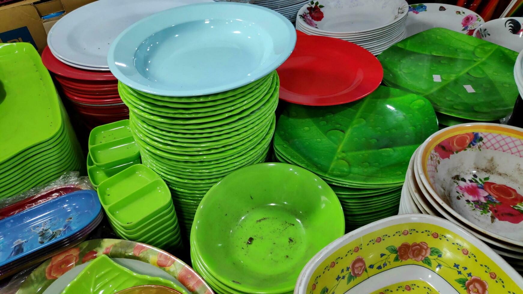 Cheap plastic household items for sale on the market close up photo