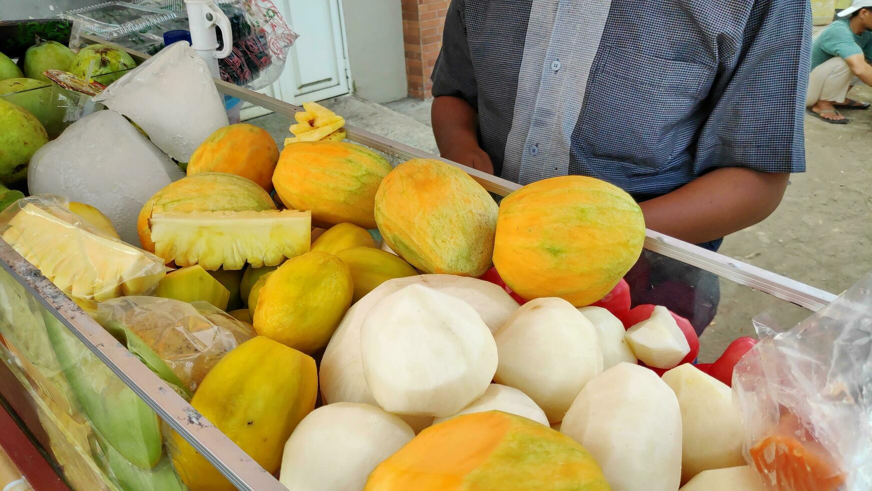 Fruit rujak cart by street vendors. Rujak fruit or traditional fruit salad from Indonesia photo