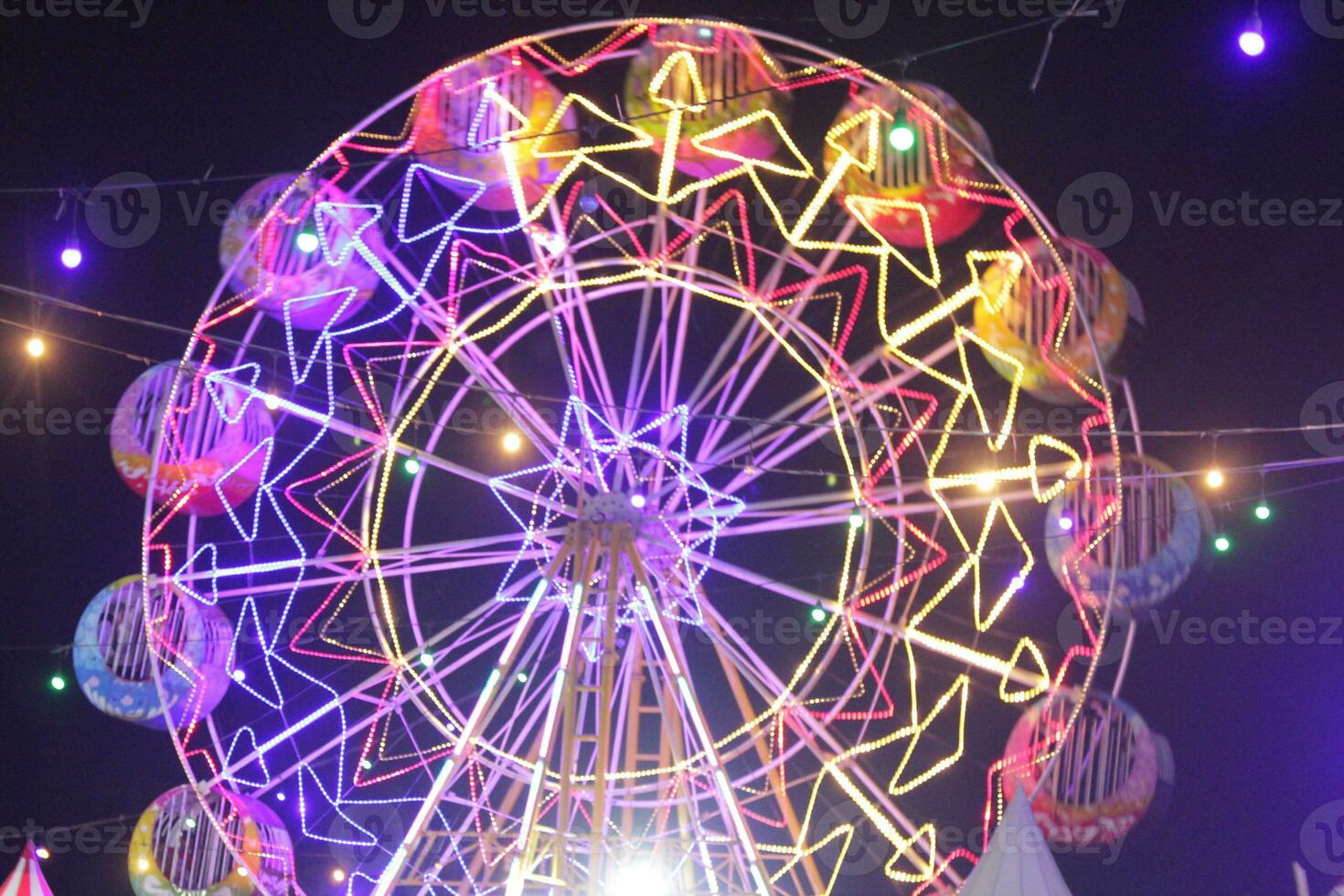Ferris Wheel ath the dark night photo