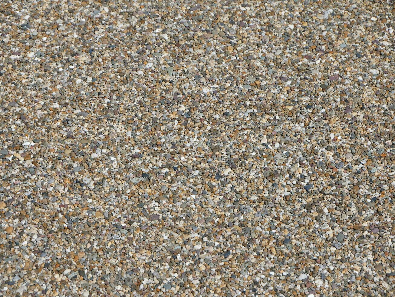 Pebble stones background, natural pattern surface photo