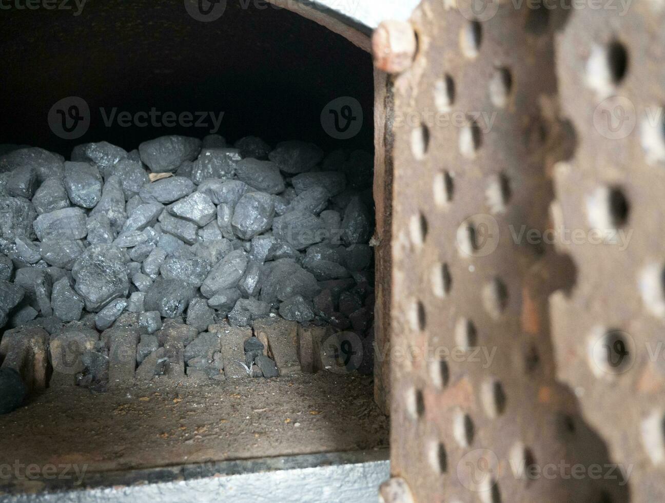 Coal in the oven, stones of coal background. Black fuel close view, coal pile at the power plant photo