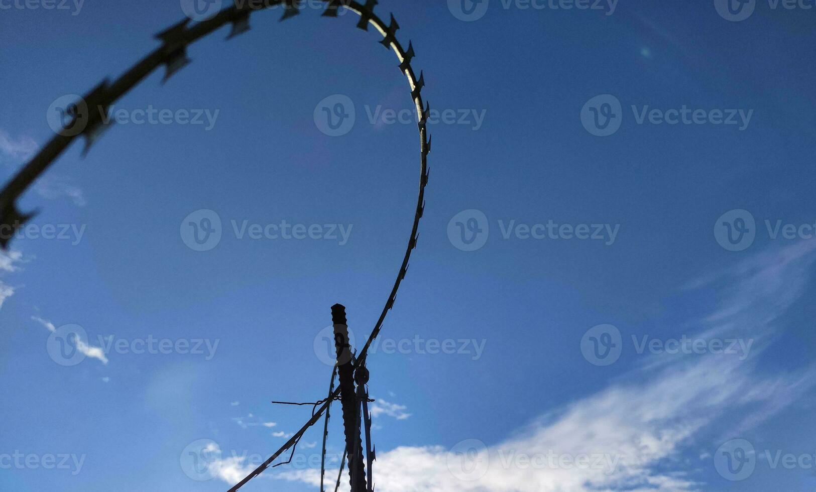 Barbed wire fence, prison and freedom conceptual background photo