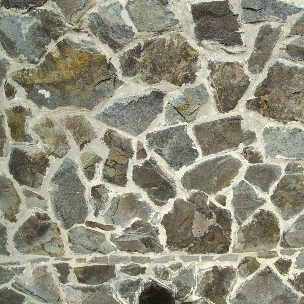 Stone texture made of different stones photo