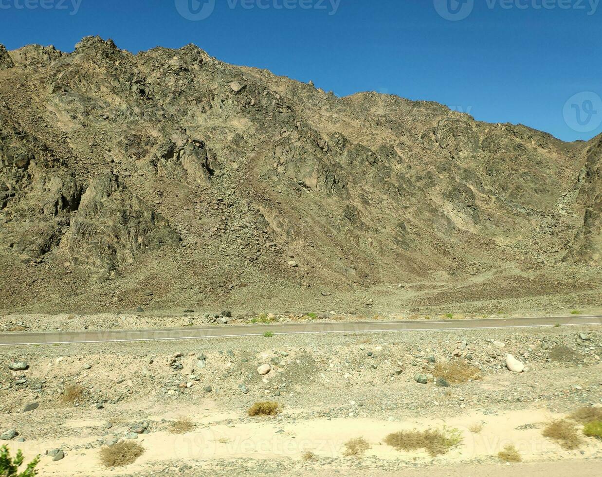 Road going through Sinai mountains, hills and desert photo
