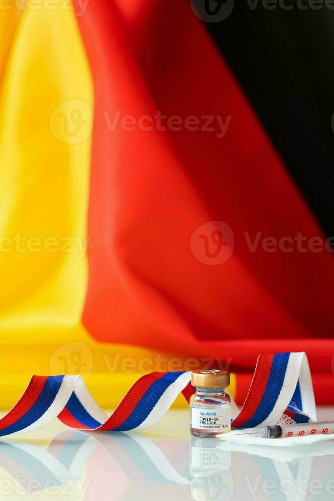 Alemania bandera con covid-19 vacuna frasco foto