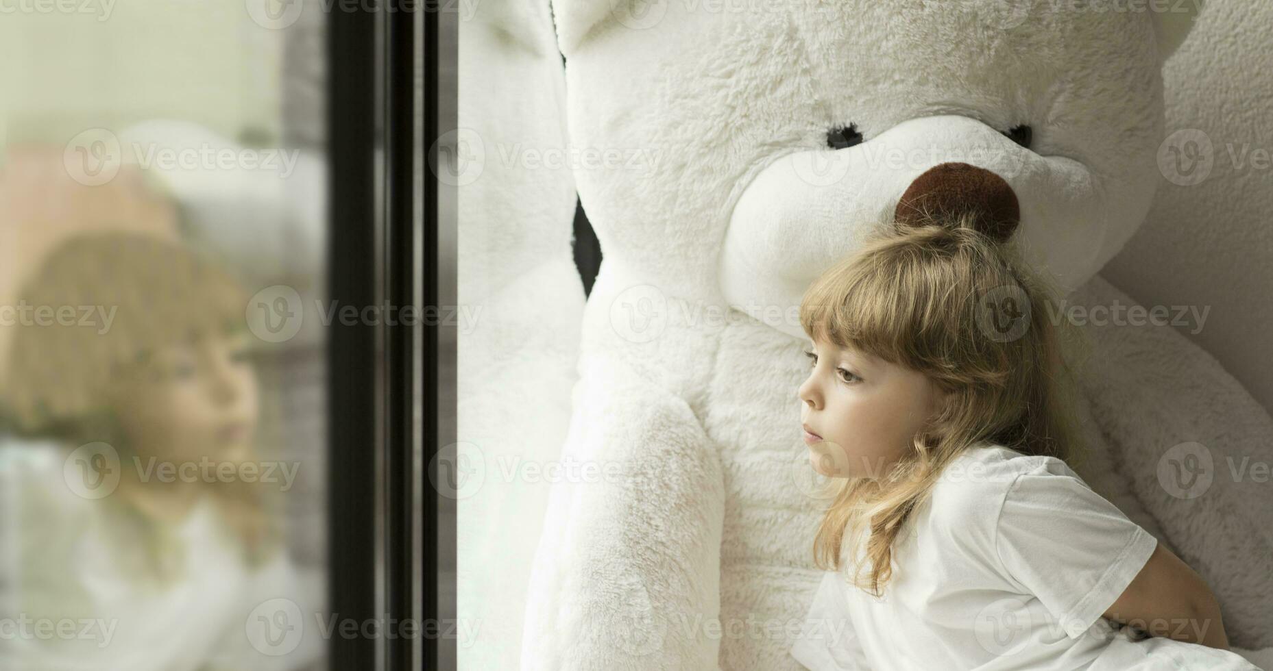 Little girl with teddy bear photo