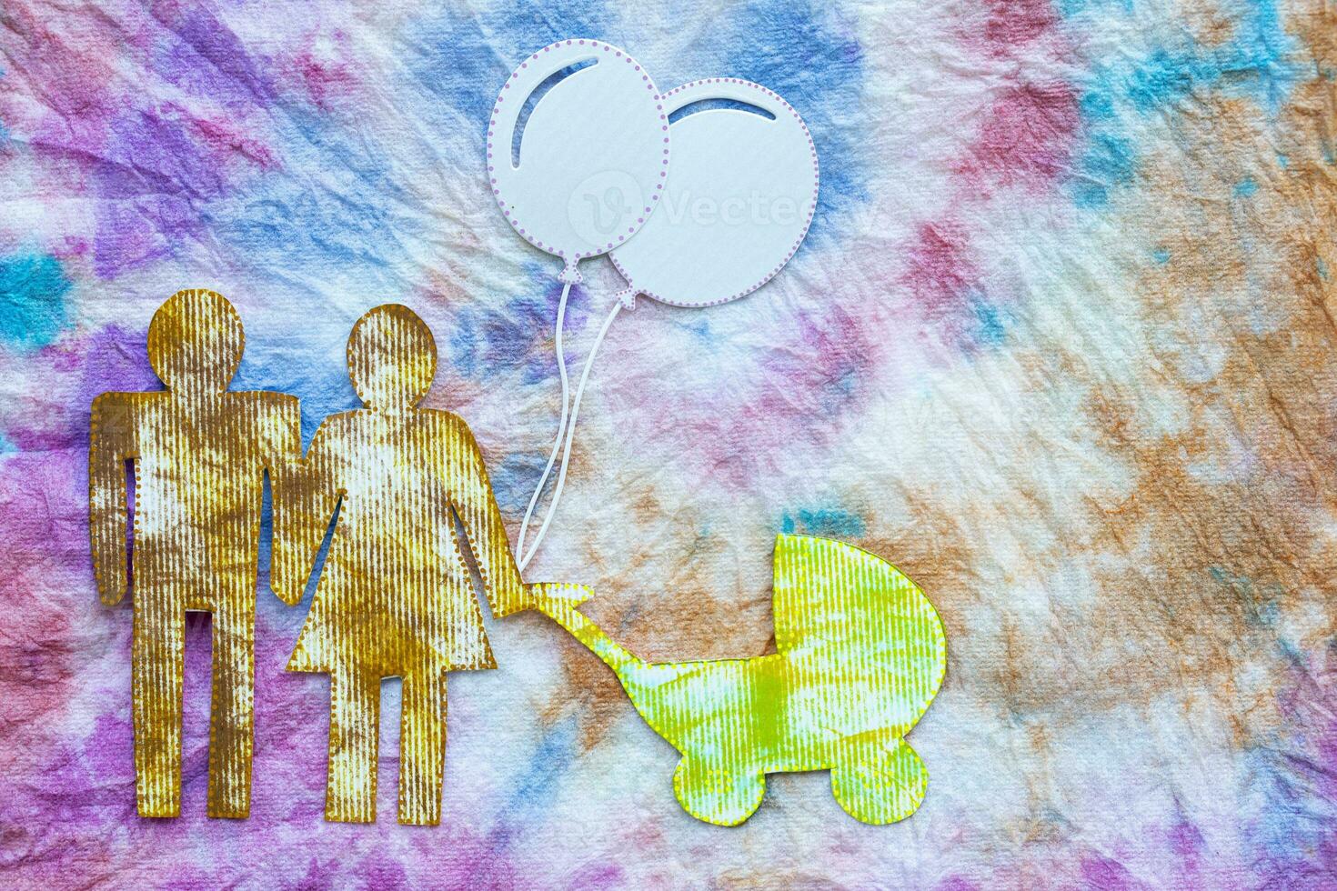 a paper cutout of a family with balloons photo
