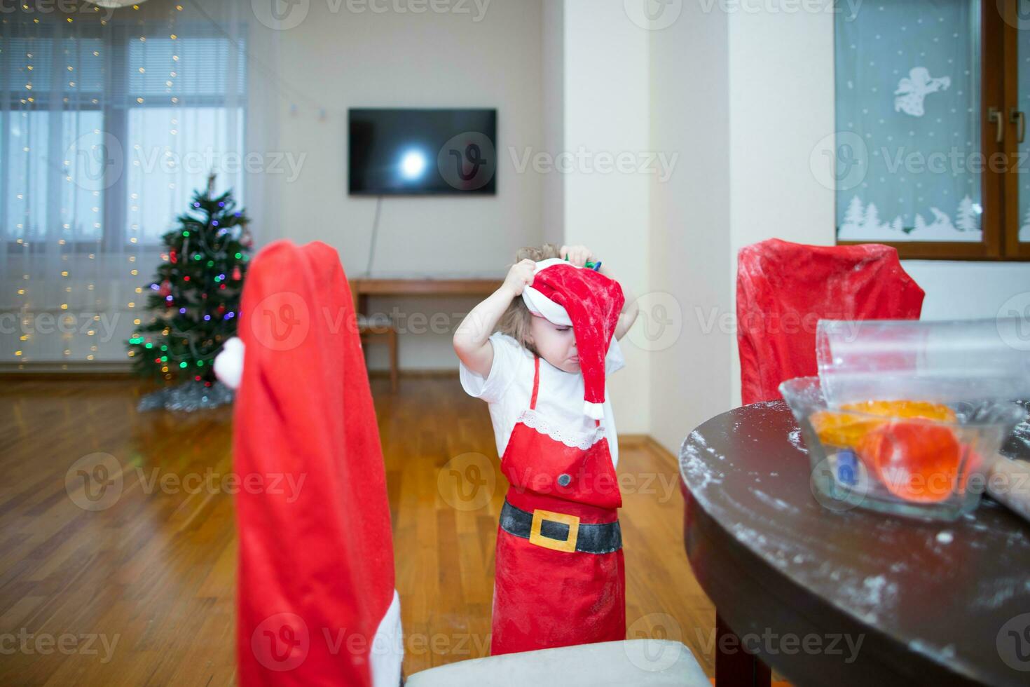 a child wearing a santa suit photo