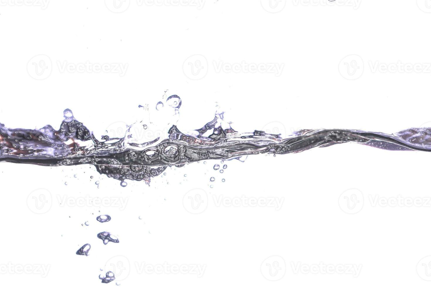 the water hits to create a beautiful wave of bubbles with a white background. photo
