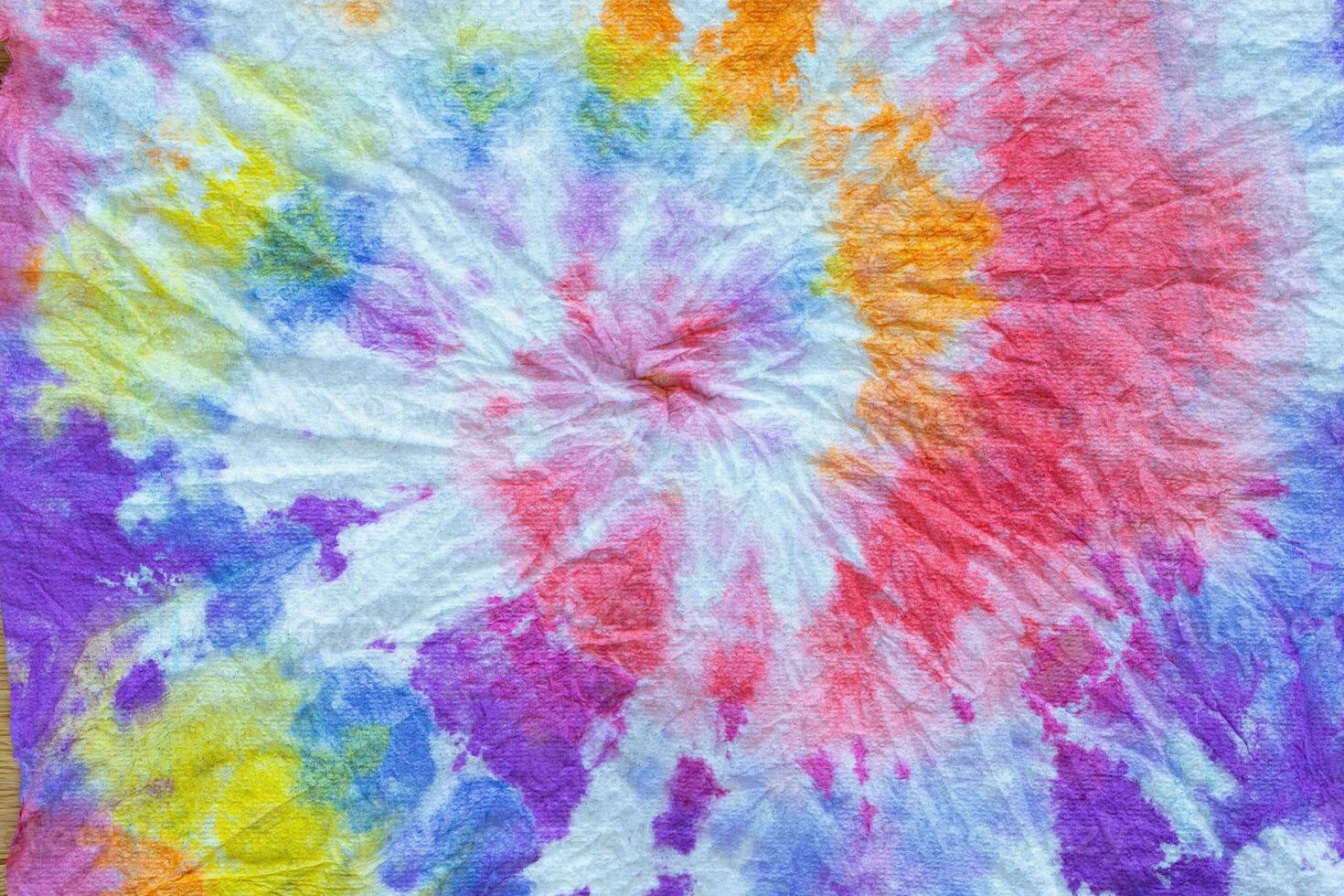 a tie dye fabric with a colorful swirl photo