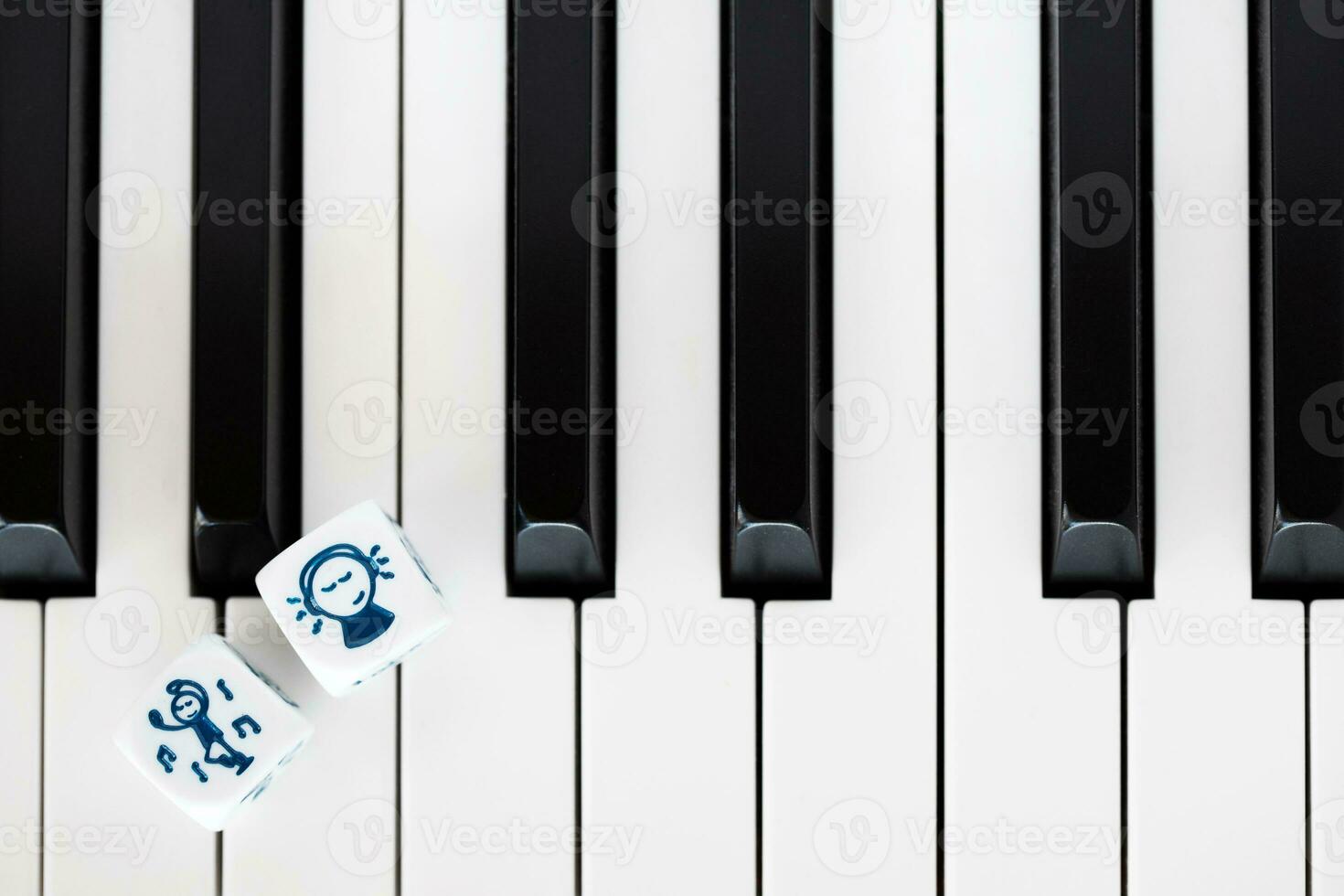 a white piano with dice on it photo