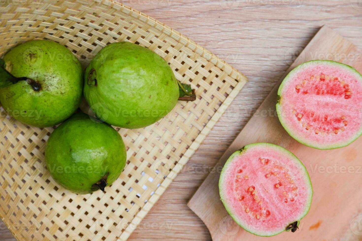 Flat lay of half cut fresh guava on the table photo