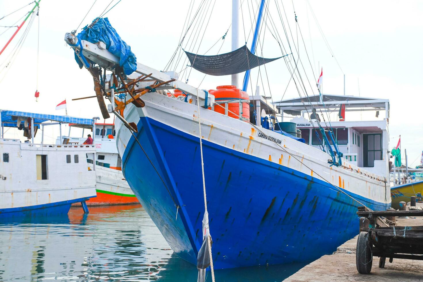 The hustle and bustle in the morning at traditional ports when loading and unloading goods and passengers photo