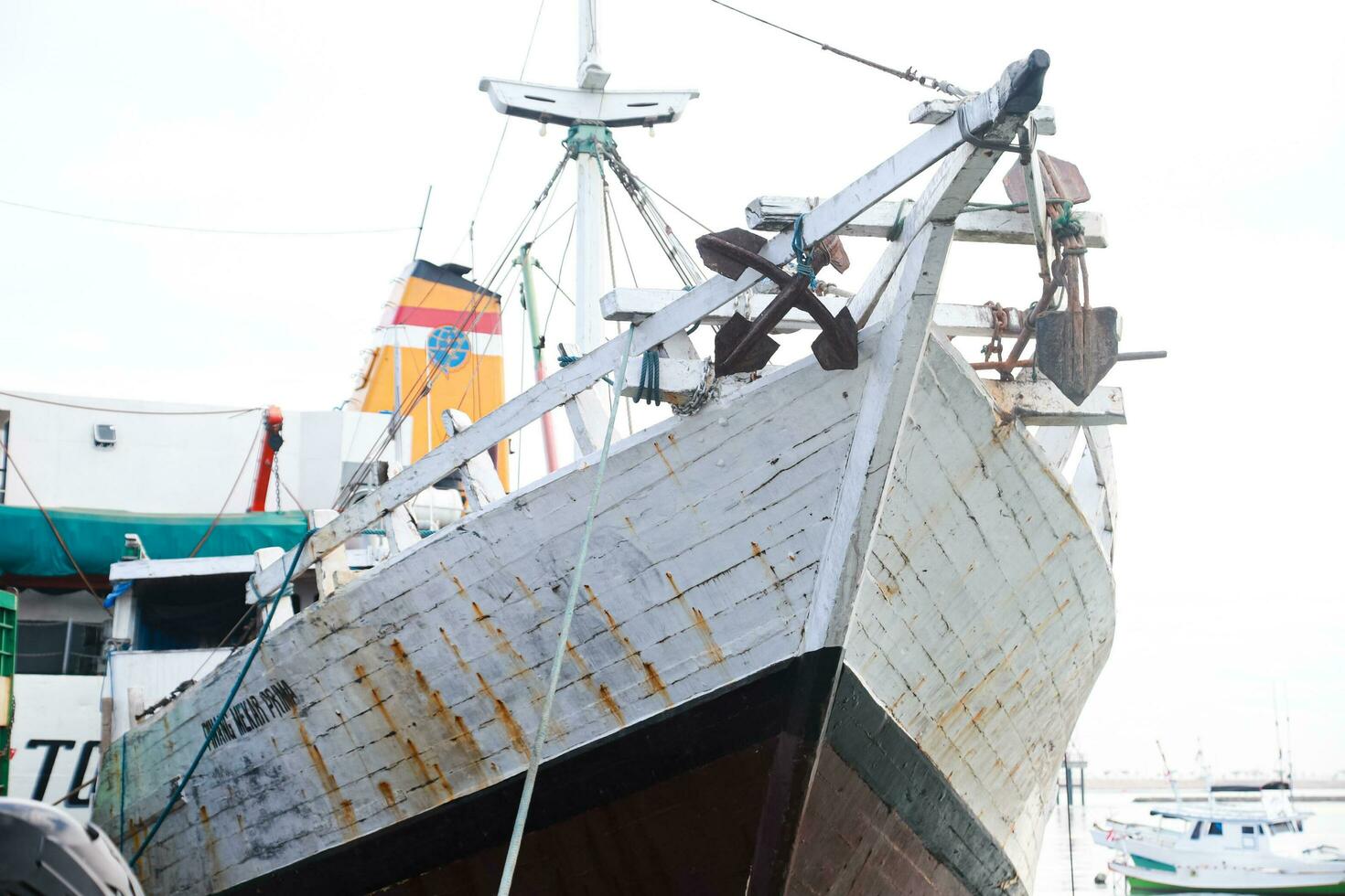 The hustle and bustle in the morning at traditional ports when loading and unloading goods and passengers photo