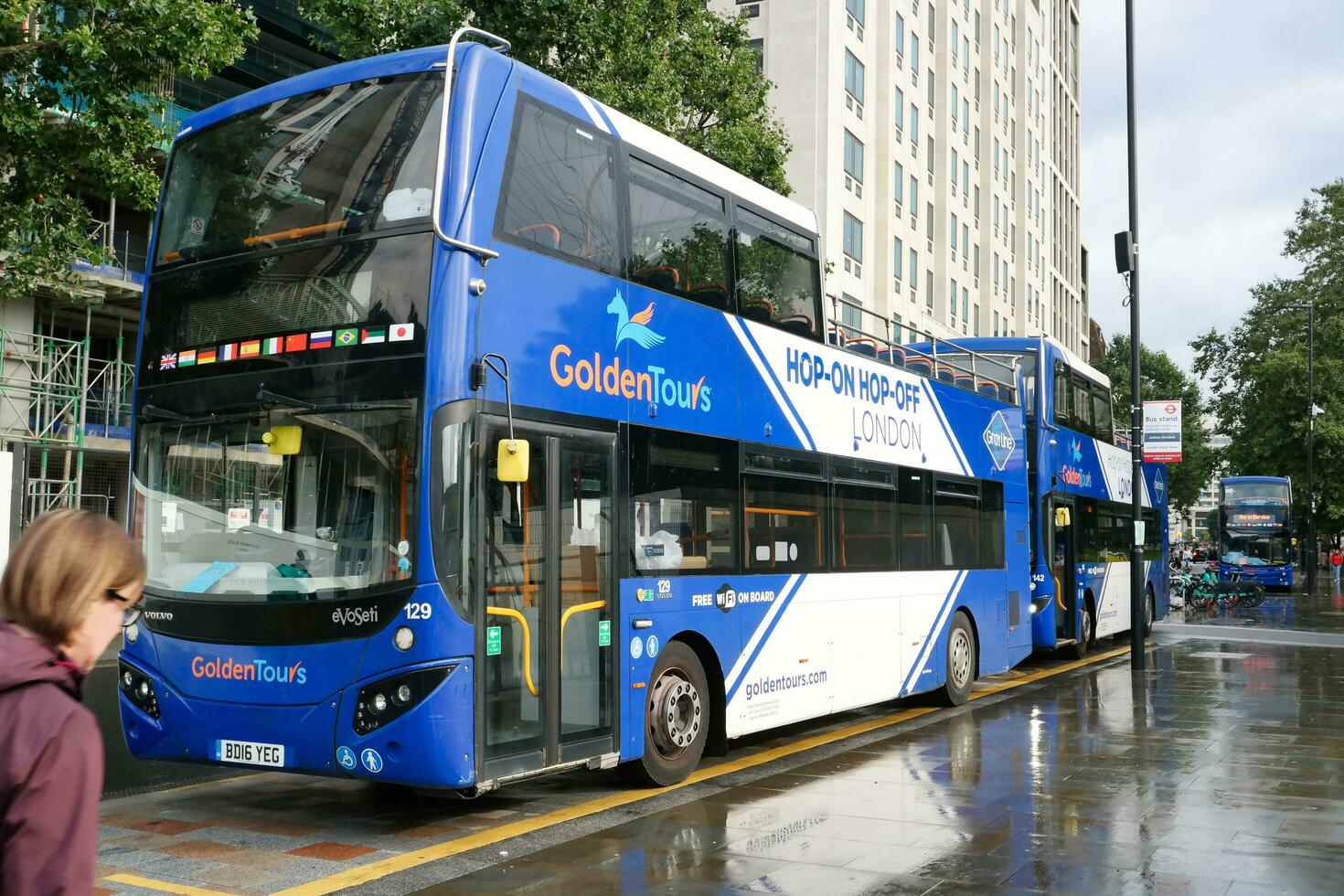Gorgeous Low Angle view of Bus Service and British Traffic at Central London City of England UK. Image Captured on August 2nd, 2023 During Cloudy and Rainy Day. photo