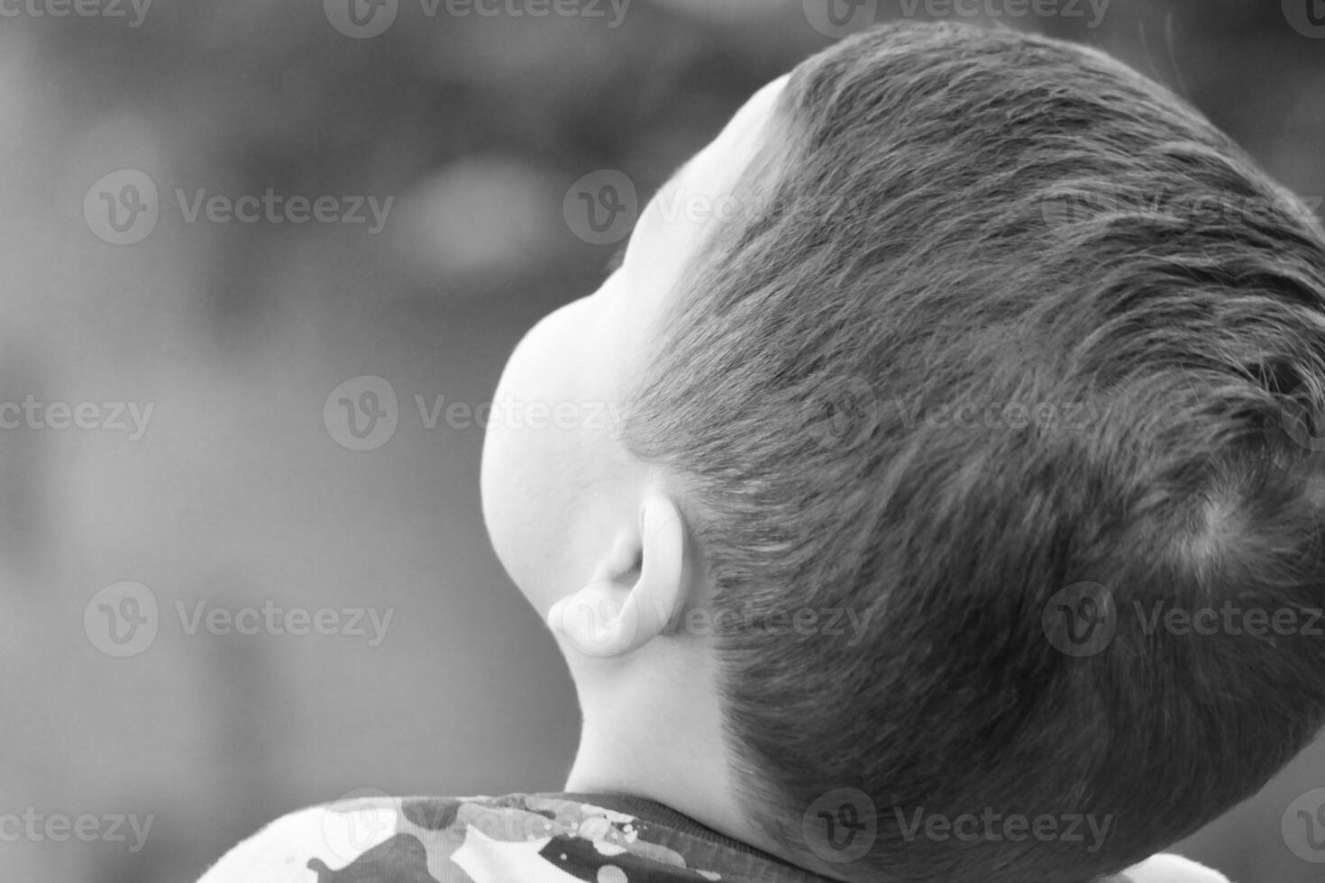 Cute Asian Pakistani Baby Boy is Posing in the Home Garden During Cloudy Day over Luton, England UK. Image Was Captured on July 23rd, 2023 photo