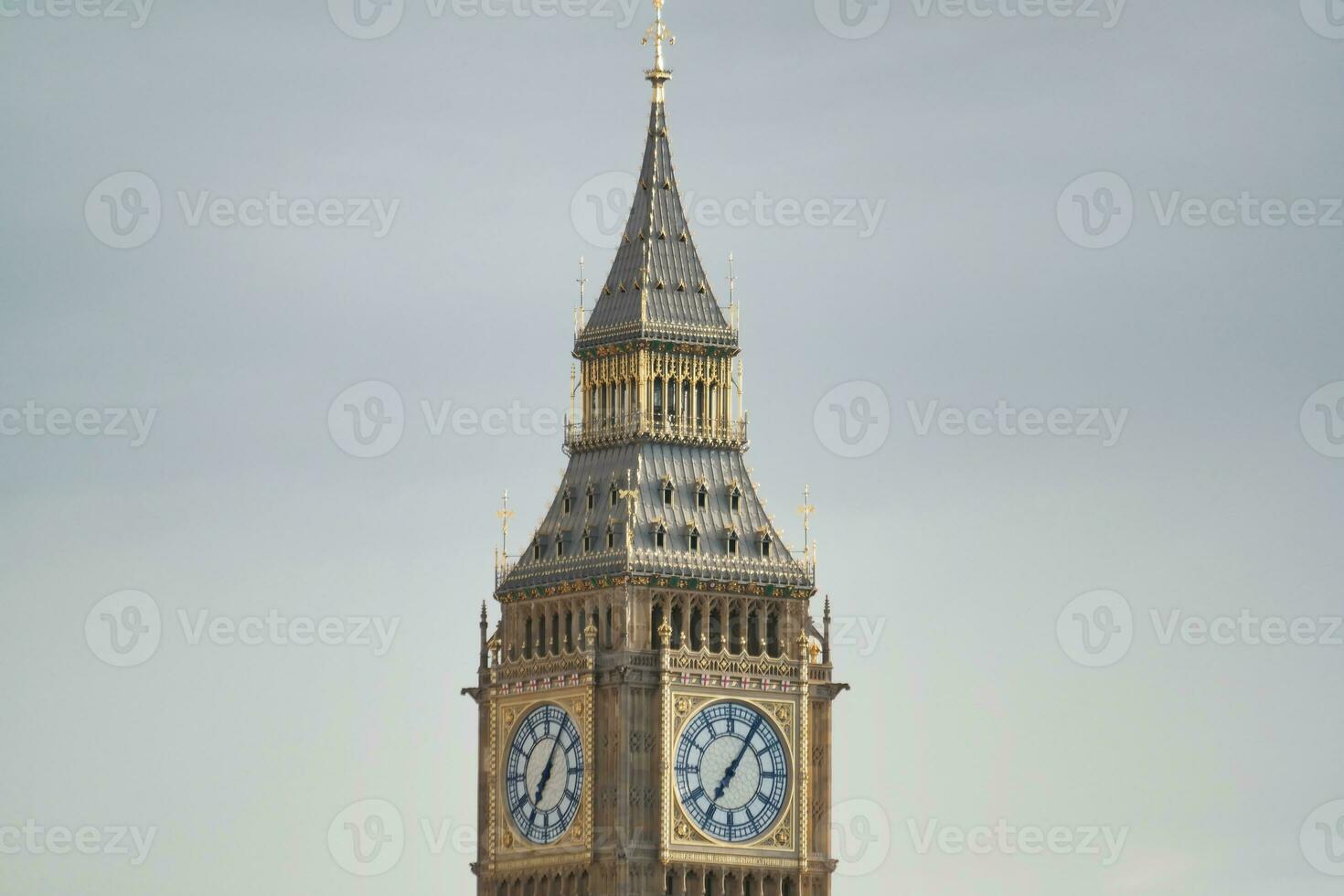 Beautiful Low Angle View of Historical Big Ben Clock Tower from river Thames and London Eye, Westminster Central London, England Great Britain, UK. Image Captured During Cloudy Day of August 2nd, 2023 photo