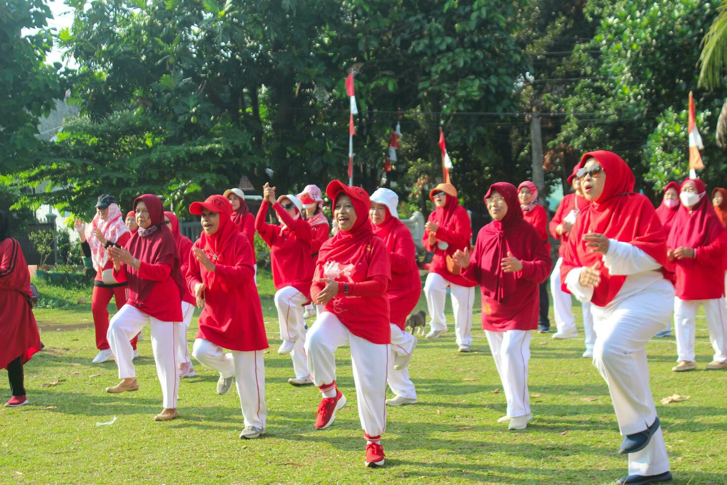 Bogor-Indonesia, August 17, 2023. photo of women doing gymnastics wearing red and white uniforms in field in celebration of Indonesia's Independence Day on August 17